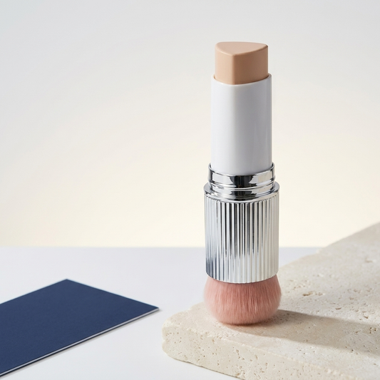 Color Changing Foundation Stick, alternate angle showing the chrome collar and brush with navy accent card