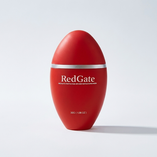 Redgate Photolyase Sunscreen Cream, red egg-shaped bottle with silver collar band, editorial studio photo