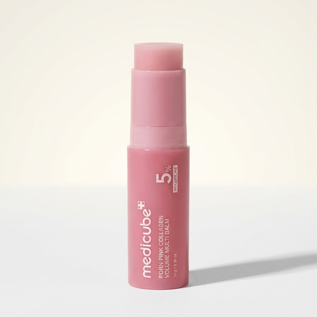 Medicube PDRN Pink Collagen Multi Balm Stick, two-tone pink twist-up stick, editorial studio photo